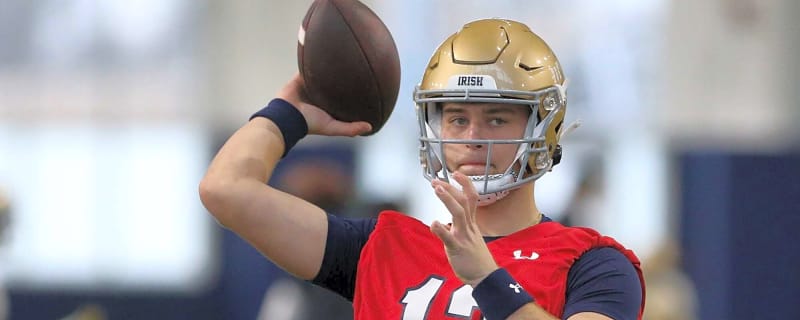 Grandson of legendary Michigan coach wins starting QB job at rival school