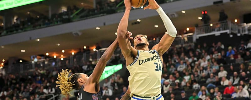 Giannis Antetokounmpo jumps out of his seat after what Thanasis did late in Bucks-Nets