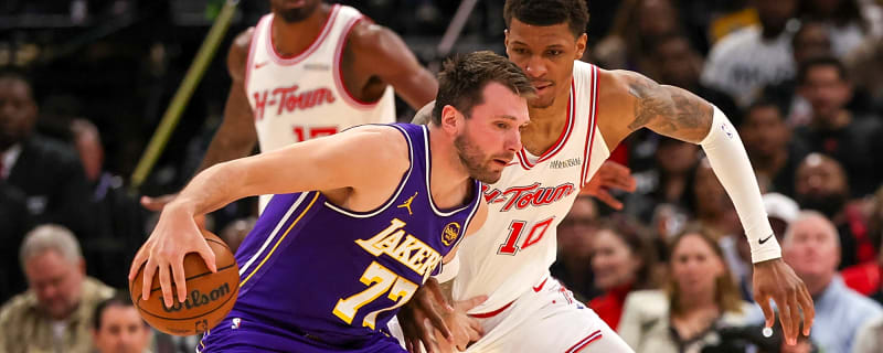 Luka Doncic trash talks a Rockets fan in the middle of live play