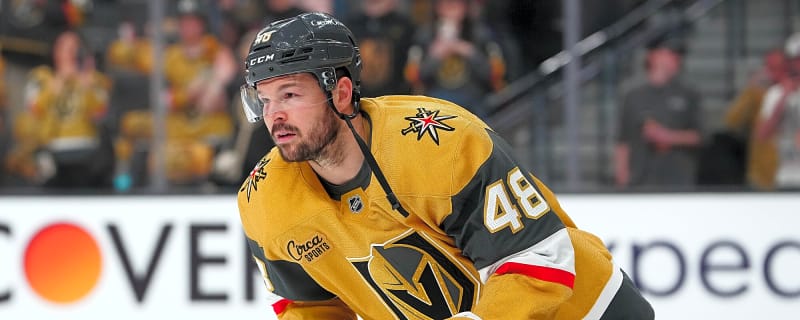 Frustrated, Tomas Hertl hits a staff member on the head with his stick