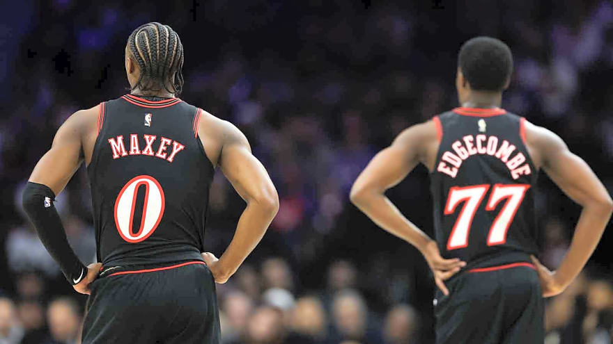 Watch this 76ers fan causally sink half court shot to earn $10,000