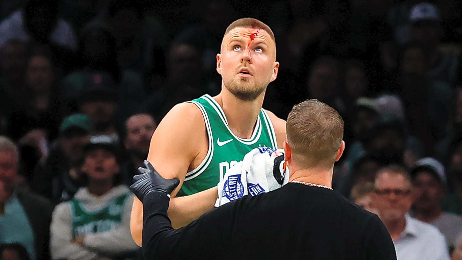 Celtics' Porzingis gushes blood after taking elbow to head