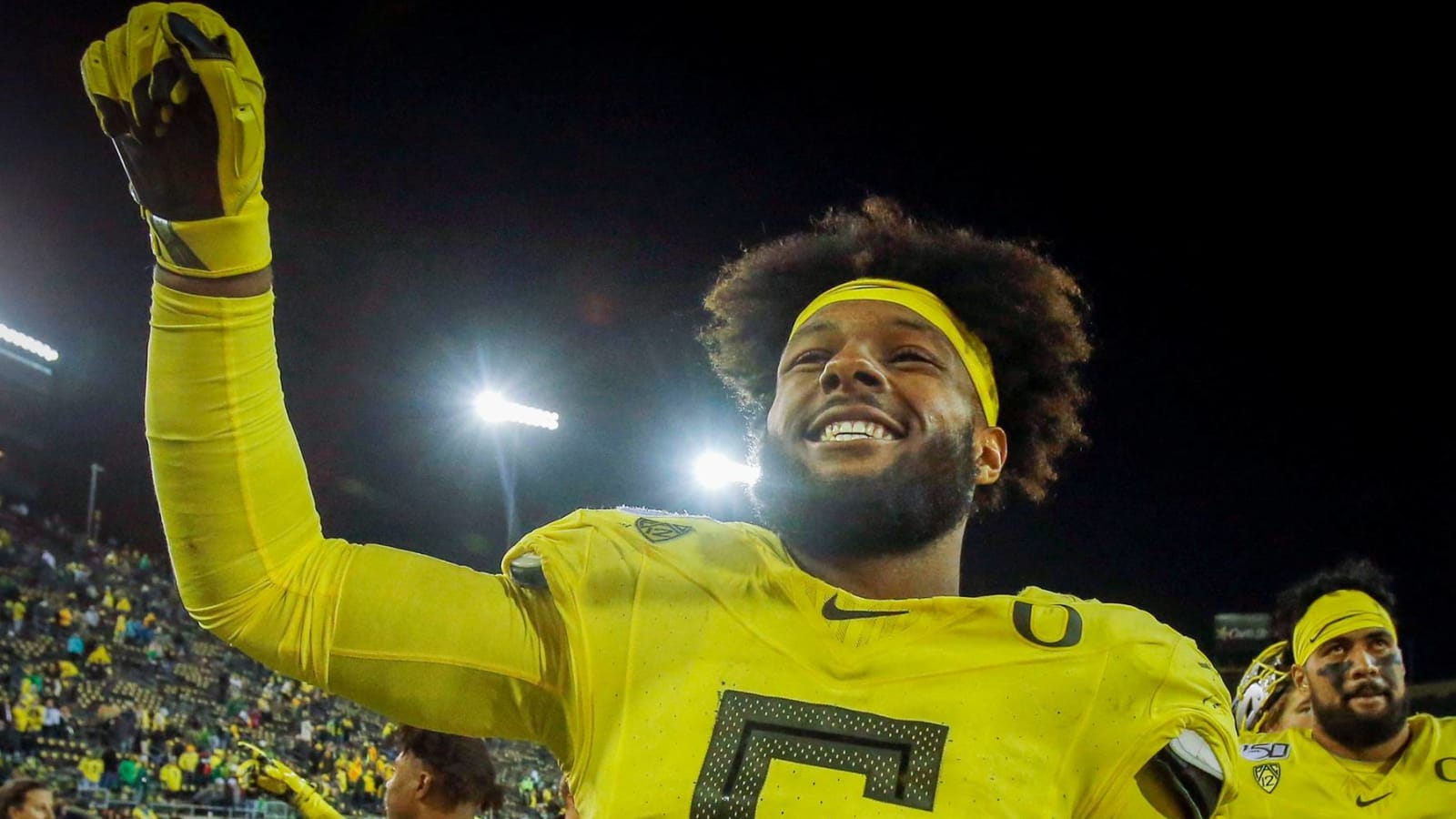 Kayvon Thibodeaux in walking boot after suffering injury