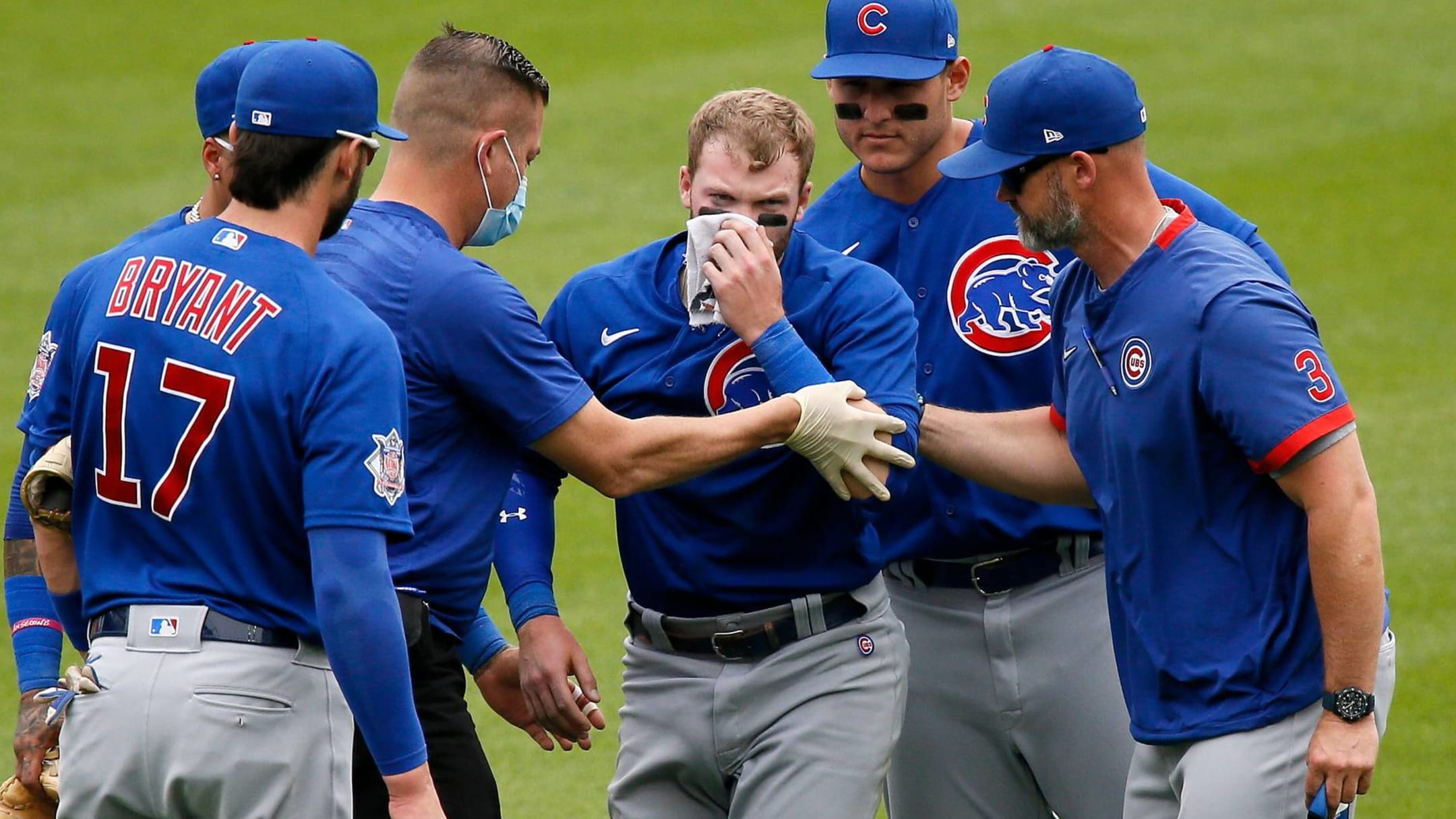 Ian Happ carted off field after scary outfield collision
