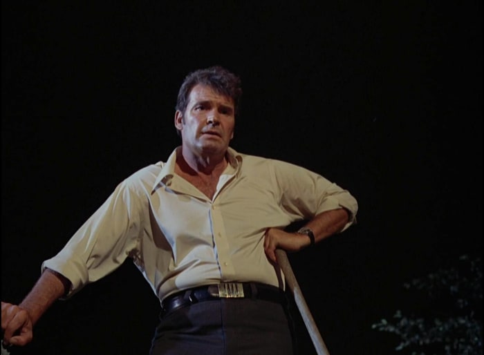 “Tall Woman in a Red Wagon”