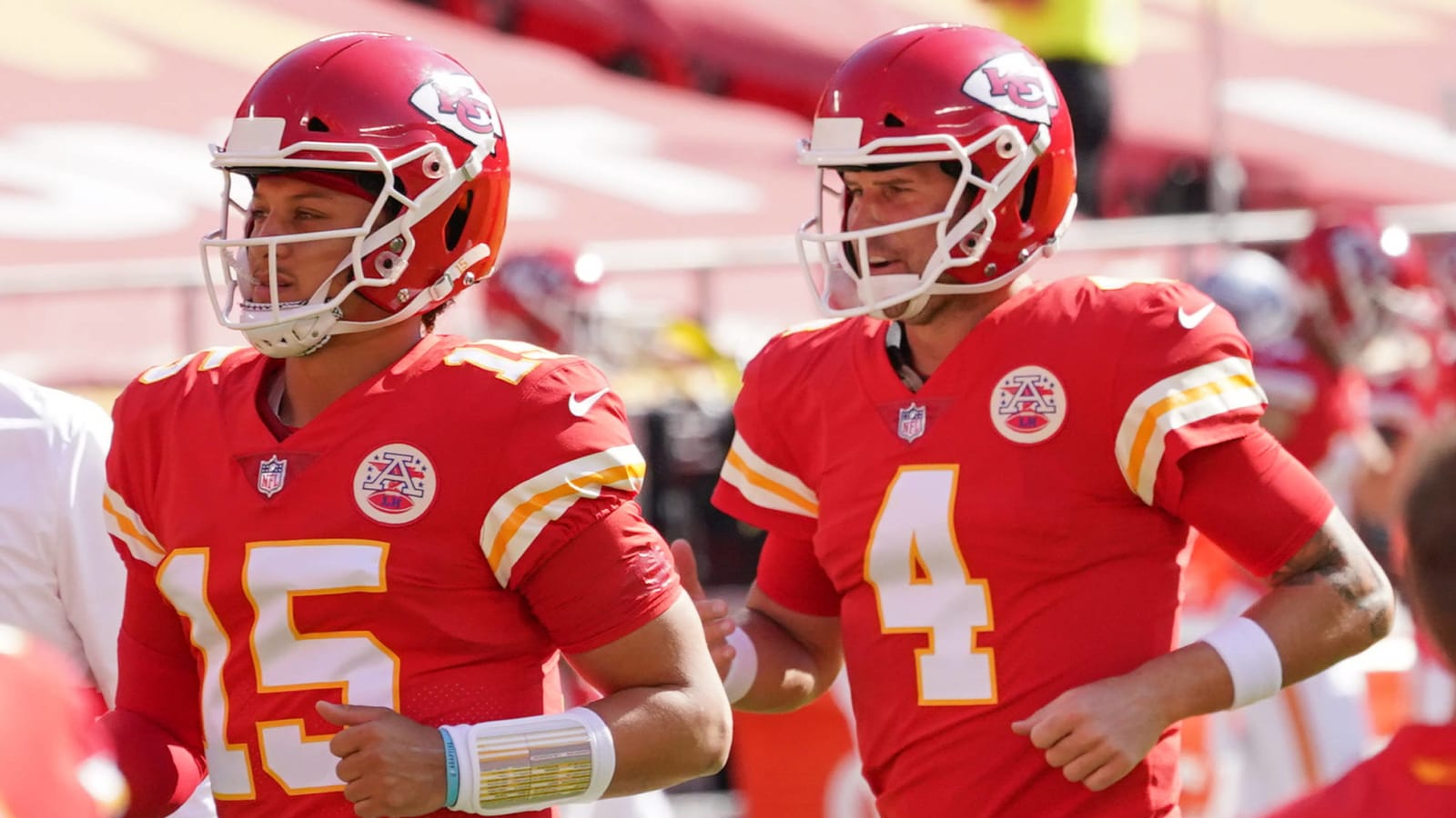 Patrick Mahomes and Chad Henne running off field