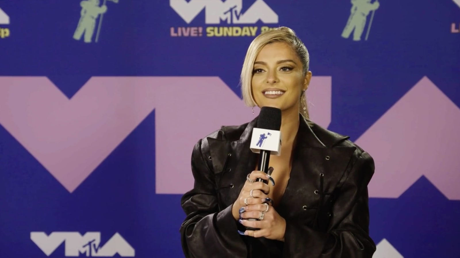 Bebe Rexha plays coy about famous women she's dated, 'even though people would be living for it'