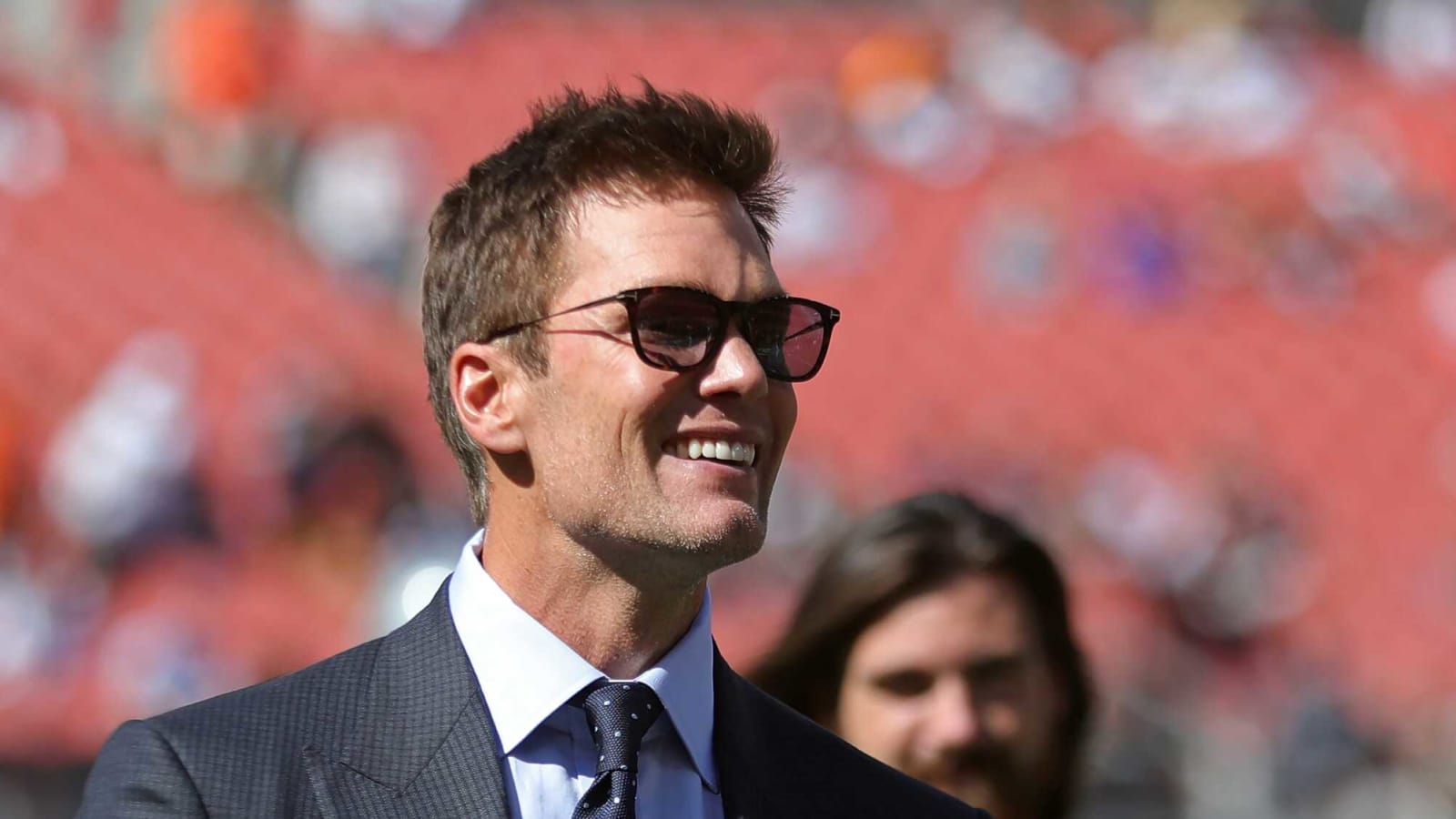Tom Brady arrives for broadcast debut in stylish suit