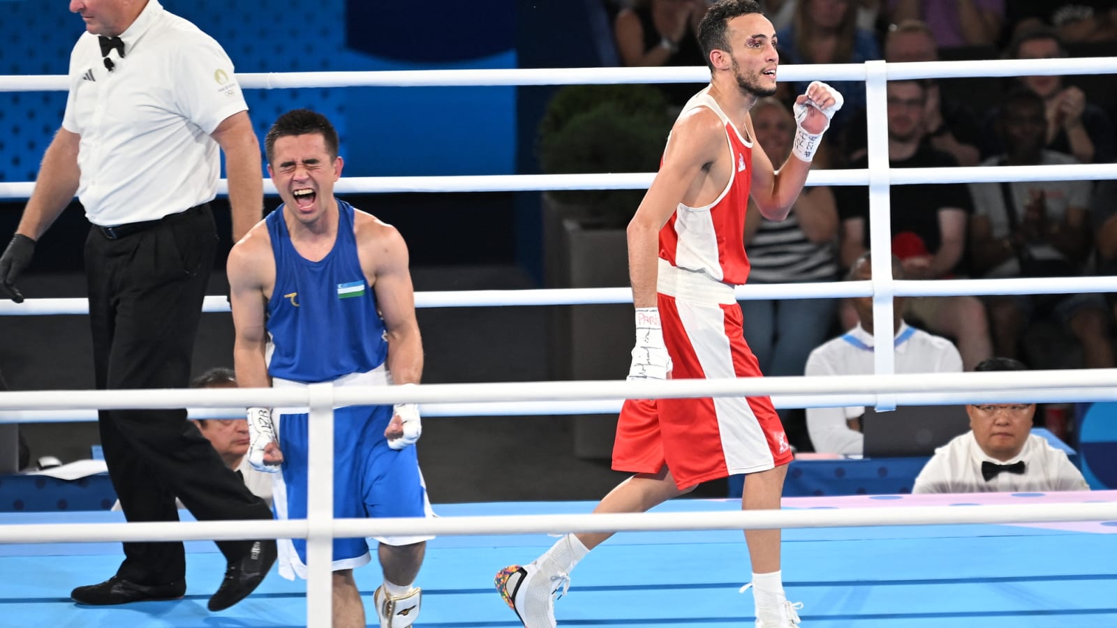 Uzbek boxer Hasanboy Dusmatov beats local favorite for gold