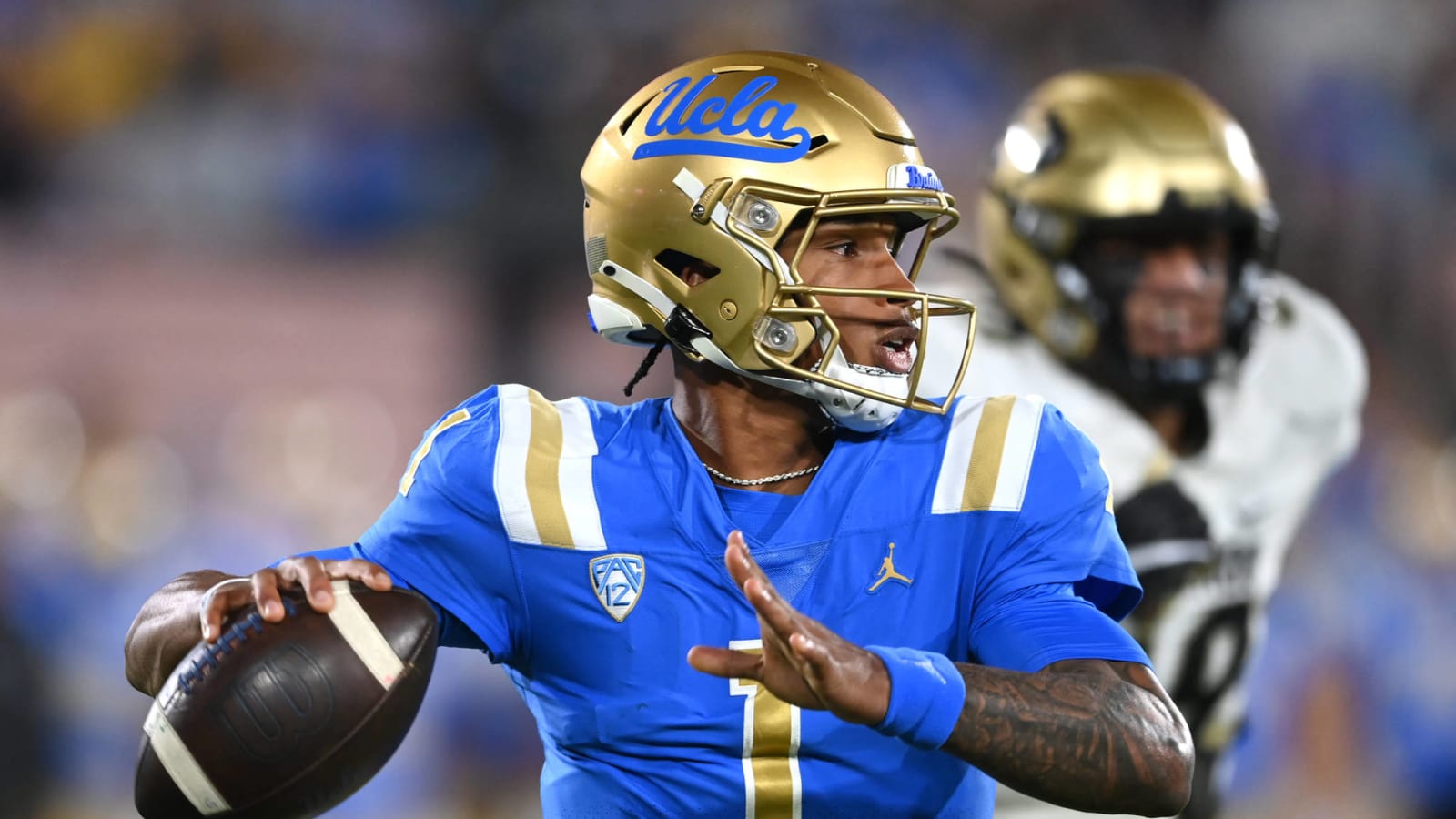 Watch UCLA QB Dorian ThompsonRobinson celebrates TD by signing a hat