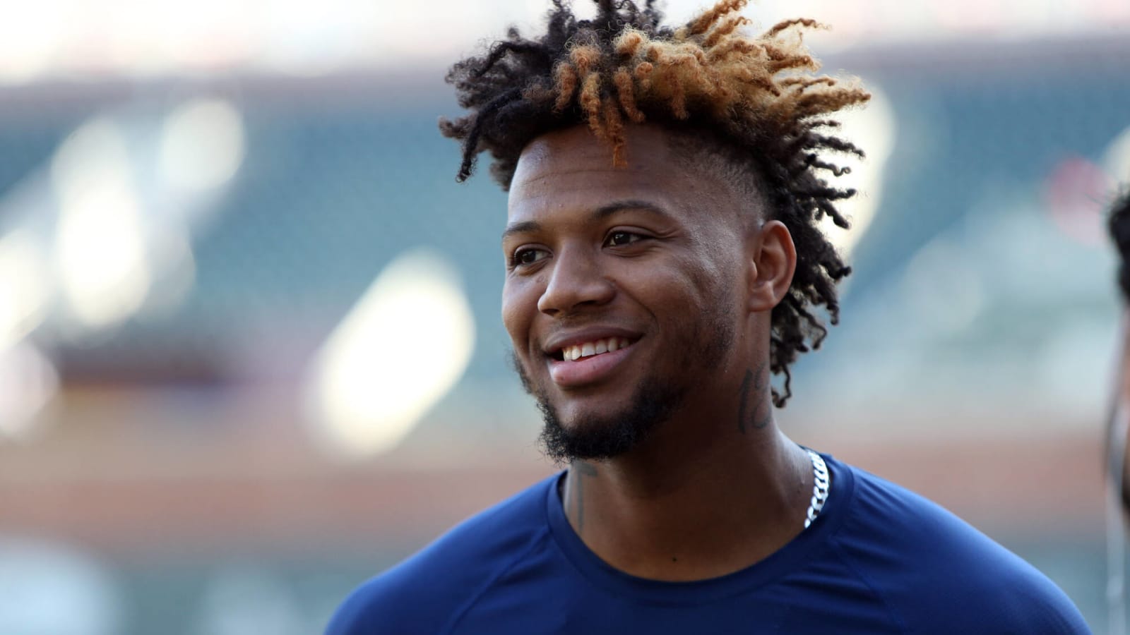 Atlanta Braves outfielder Ronald Acuña Jr. confronted by two fans