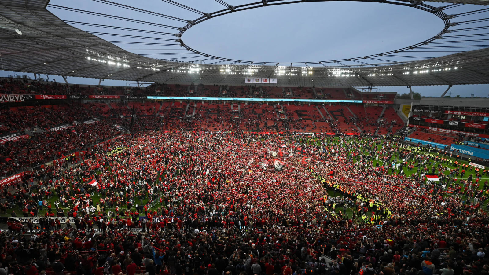 Watch: Bayer Leverkusen fans swarm field after title win