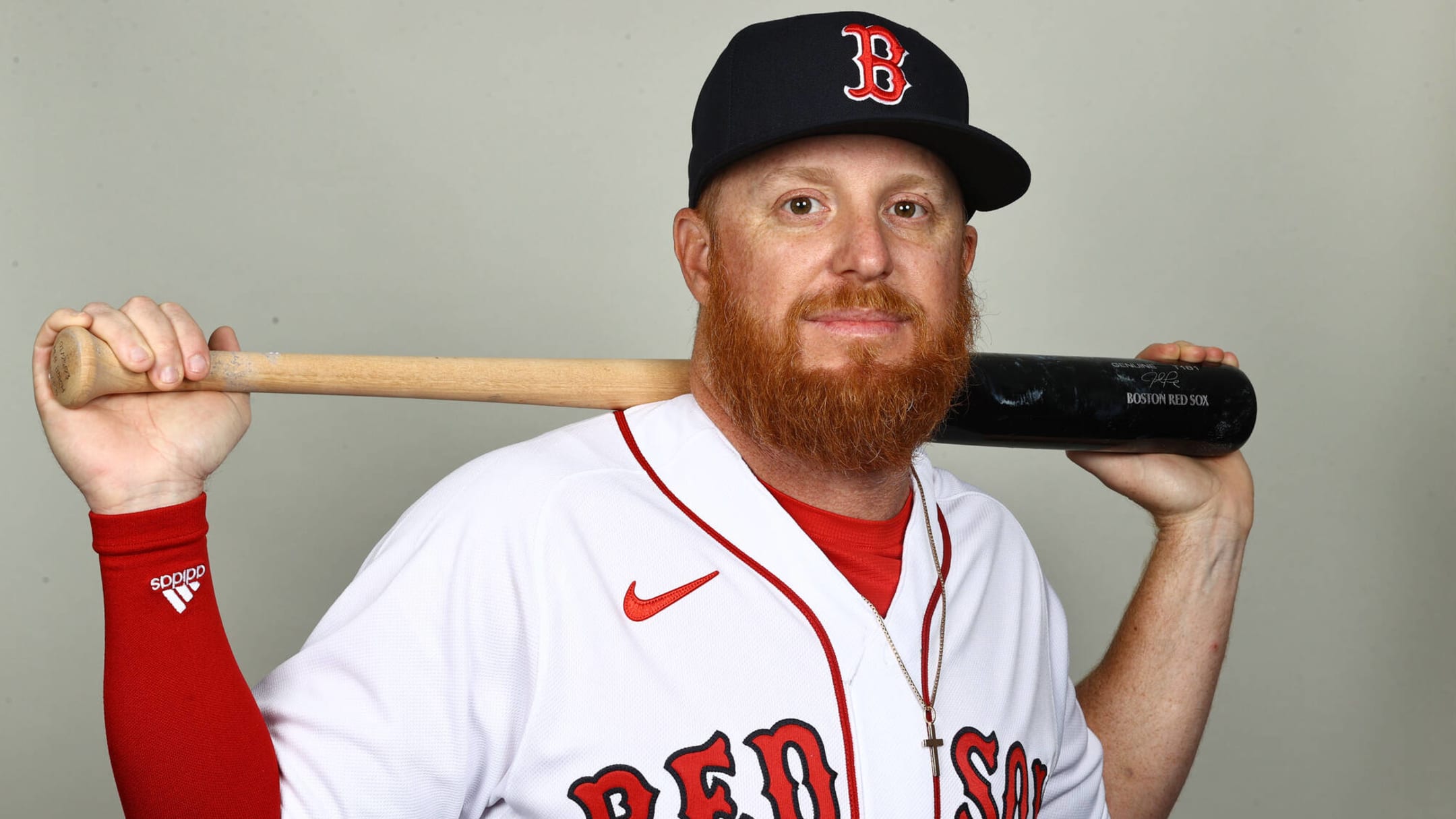 Justin Turner of the Boston Red Sox talks with manger Alex Cora