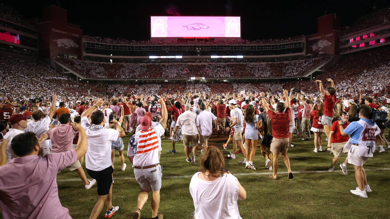 Arkansas fined for fans storming field after win over Texas