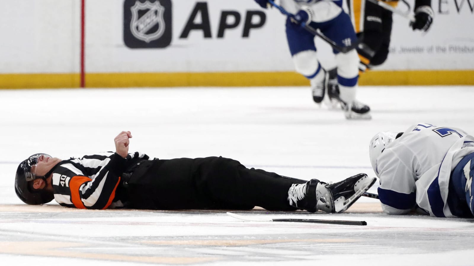 NHL referee removed on stretcher after terrifying collision