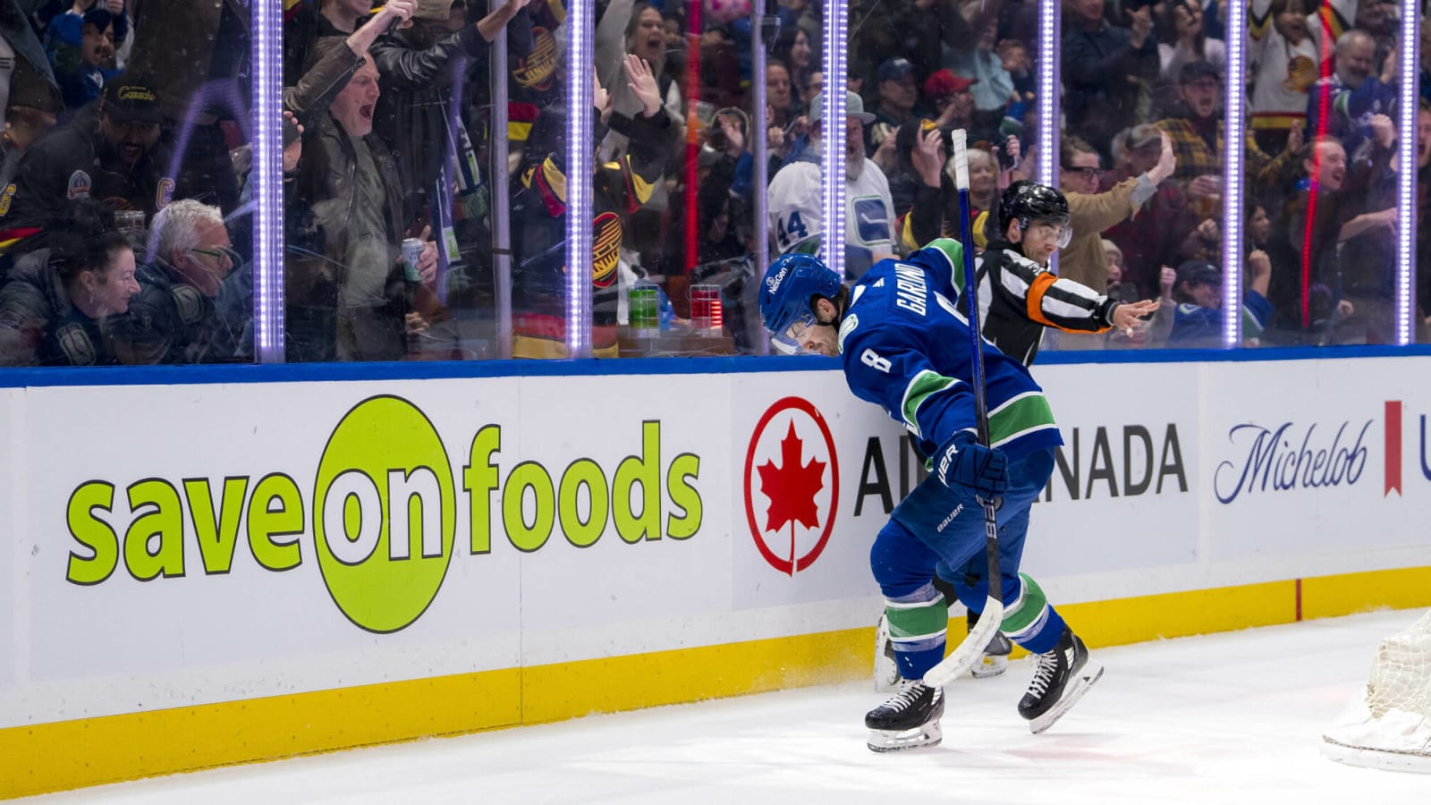 Conor Garland’s teammates wore shirts with his face on them and Canucks fans chanted his name in eventful 400th career game