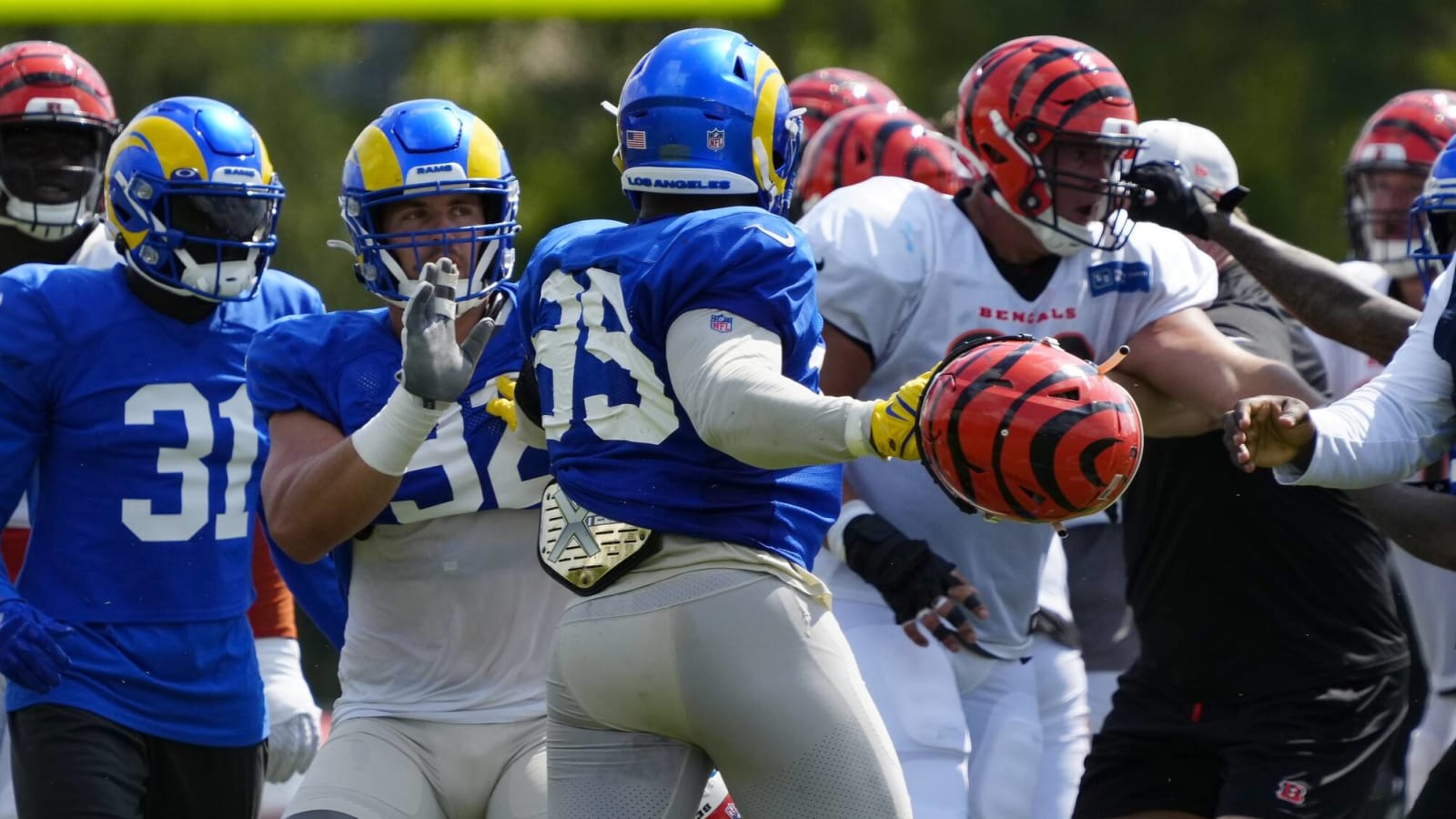 Adam Schefter has just one word to describe Aaron Donald's swinging double-helmets: 'Assault'