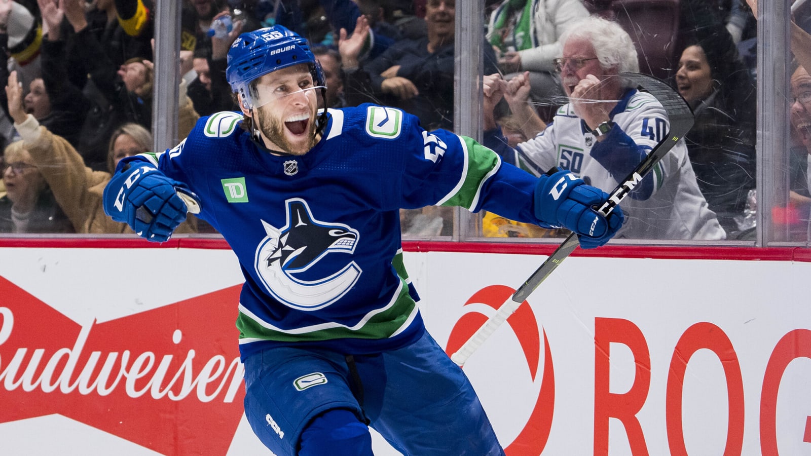 Canucks place Jett Woo and Guillaume Brisebois on waivers