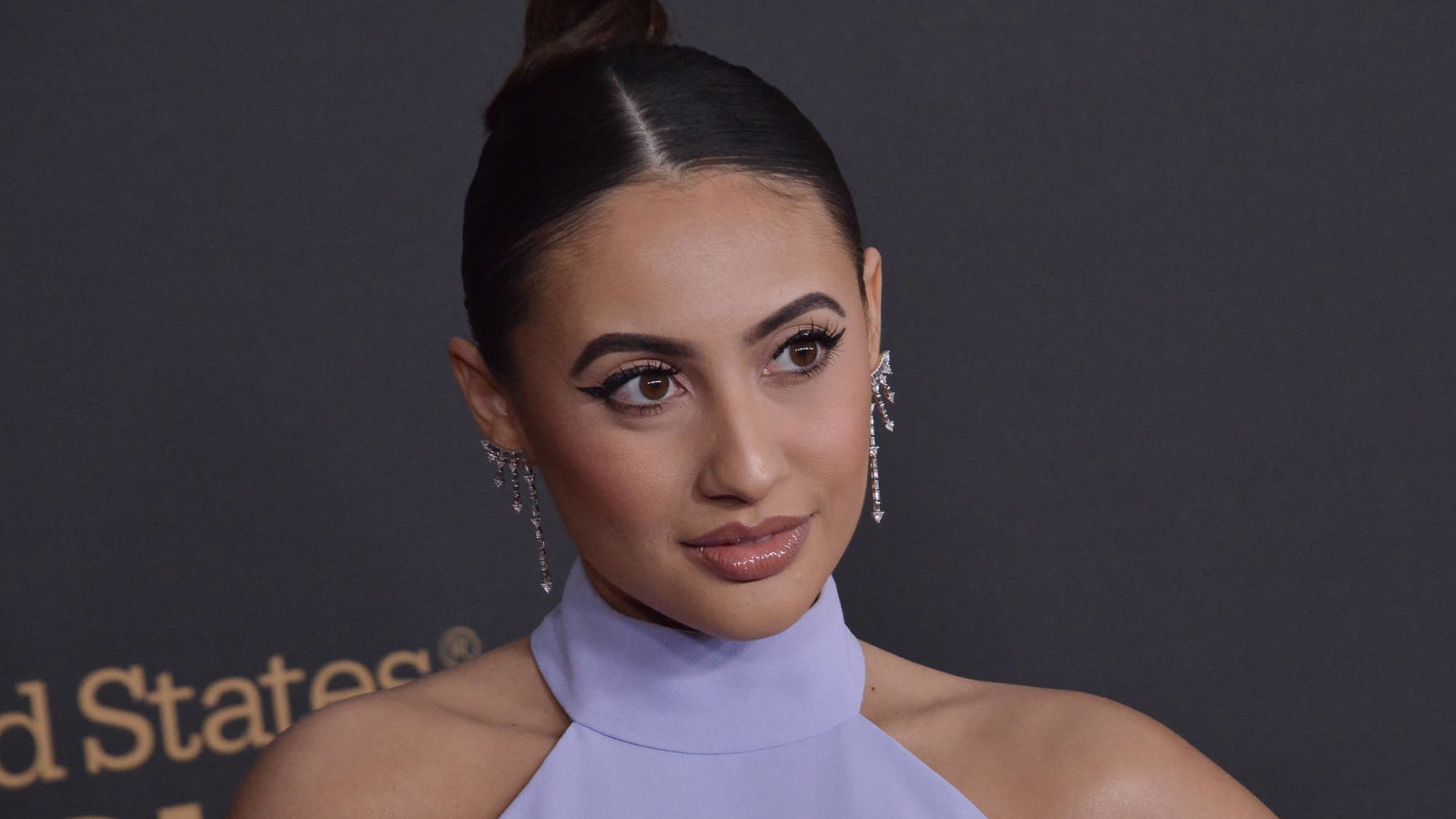 Francia Raisa explains how she ended up topless in a hot tub with Tyra Banks