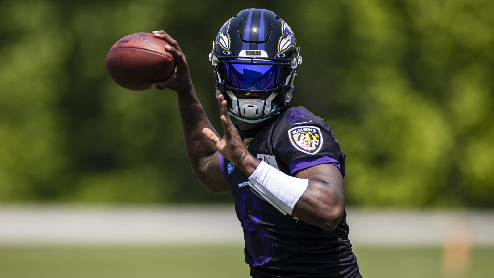 Lamar Jackson not at training camp due to COVID issues