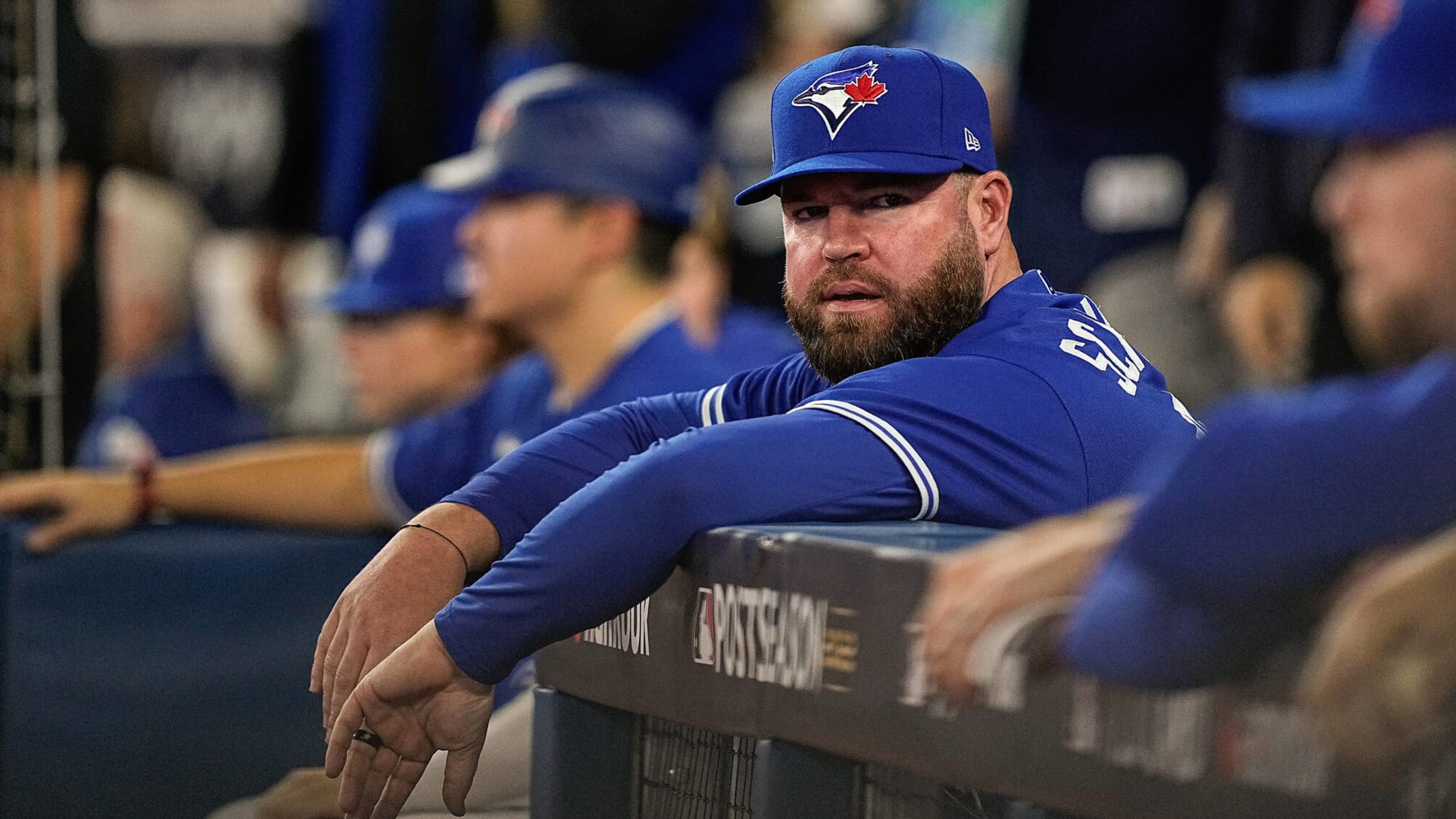 Toronto Blue Jays manager John Schneider, left, plays with his