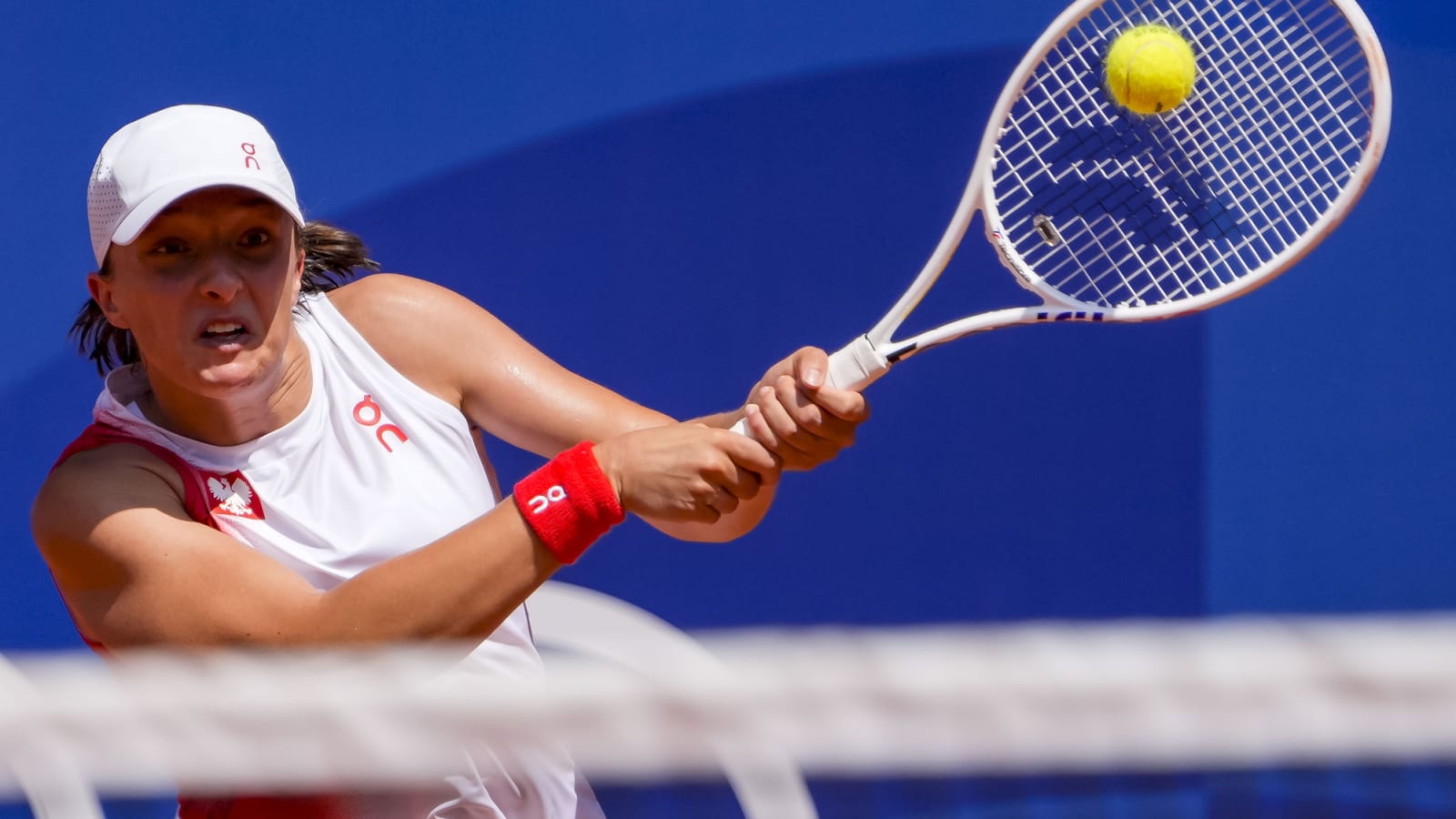 Iga Swiatek beats Anna Karolina Schmiedlova in straight sets to become first Polish tennis player to win an Olympic medal