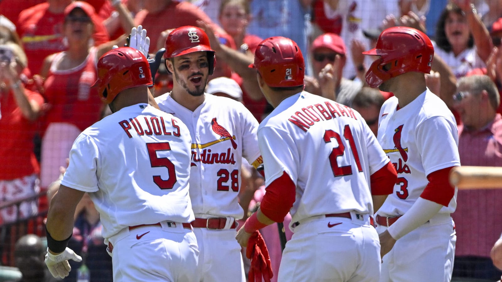 Albert Pujols gives teammate Brendan Donovan words of encouragement after pinch-hitting for him