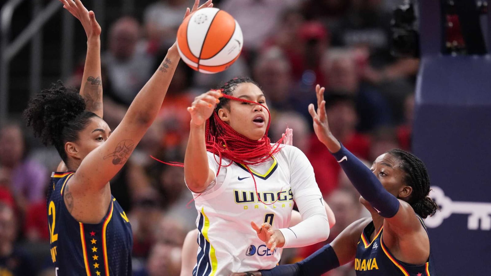 Dallas Wings forward Satou Sabally passes against Fever center Temi Fagbenle at Gainbridge Fieldhouse