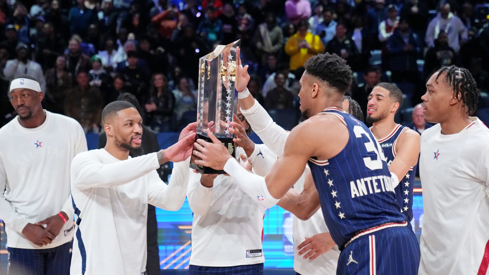 Damian Lillard and Giannis Antetokounmpo hold the trophy after winning the 73rd NBA All-Star game at Gainbridge Fieldhouse