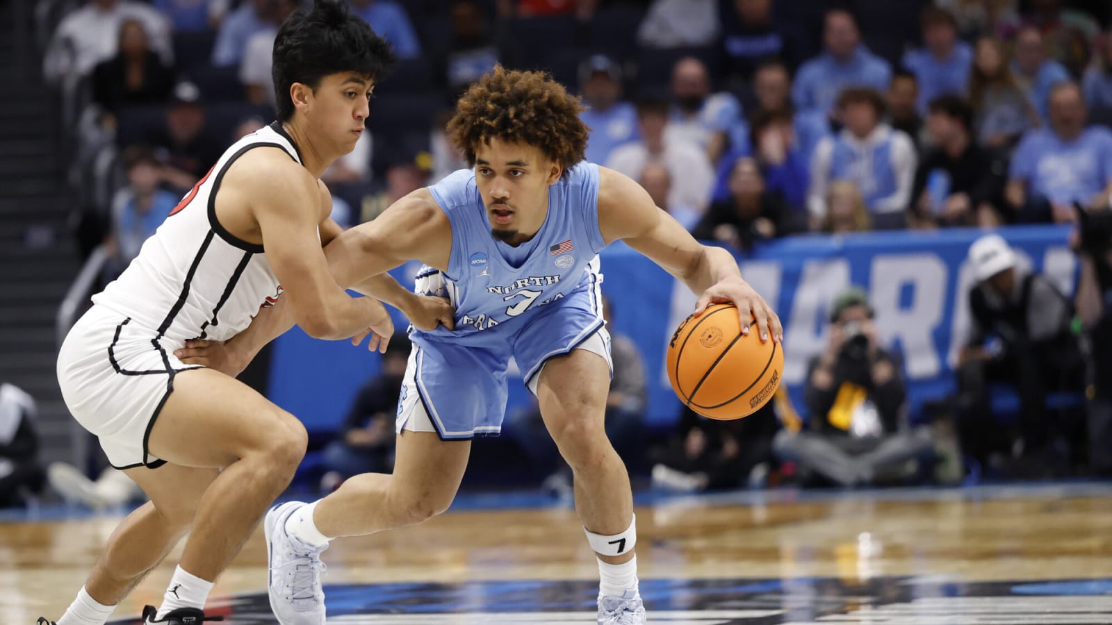 Tar Heels guard Seth Trimble dribbles past Aztecs guard Kimo Ferrari at UD Arena