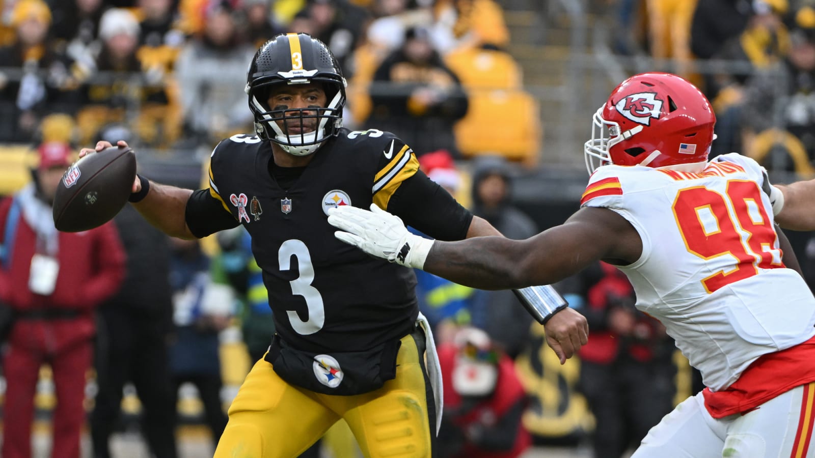 Chiefs defensive tackle Tershawn Wharton pressures Steelers quarterback Russell Wilson at Acrisure Stadium