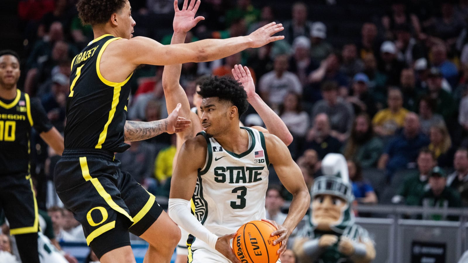 Michigan State guard Jaden Akins (3) holds the ball while defended by Oregon guard Jadrian Tracey (2)