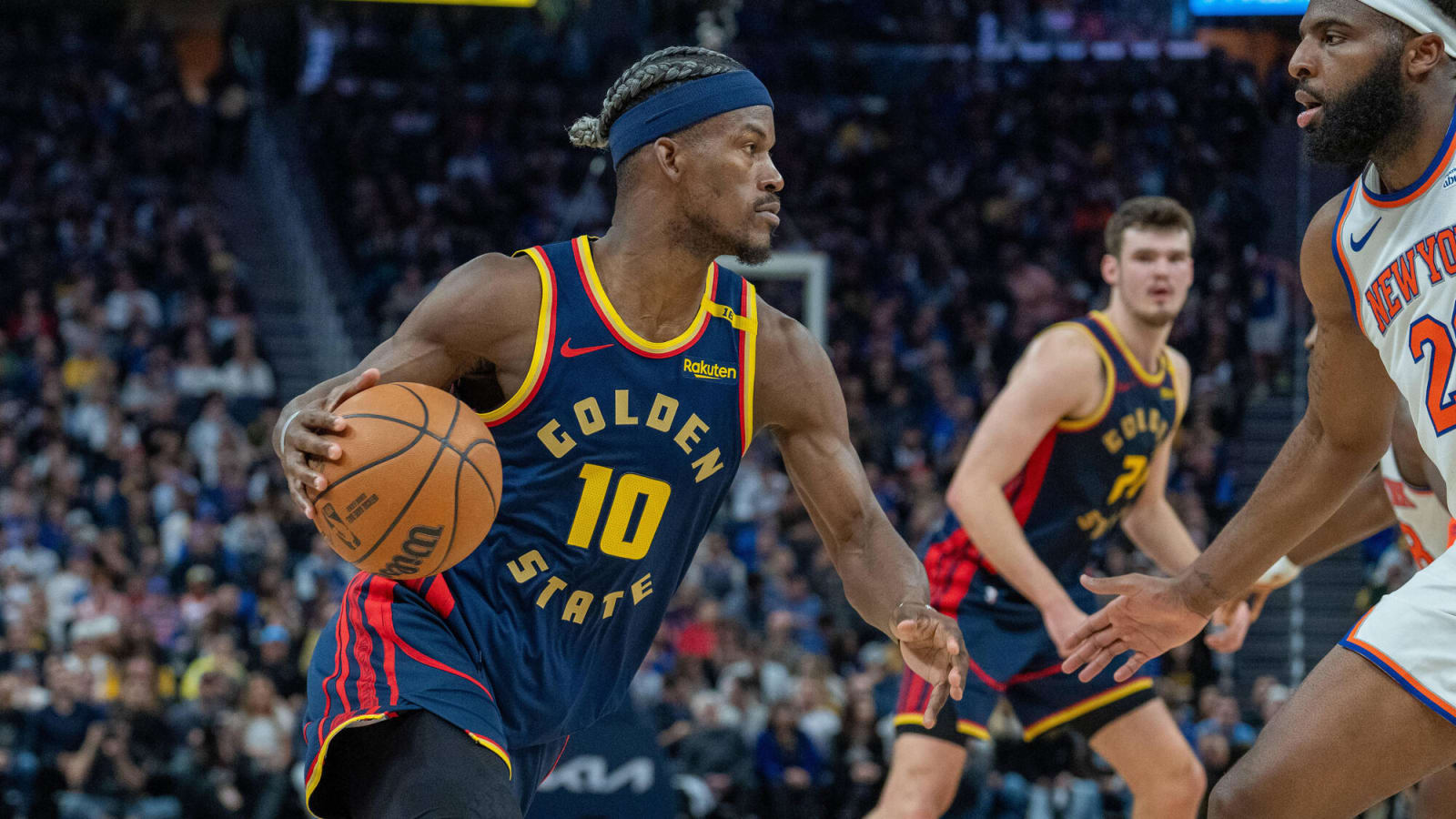 Jimmy Butler in a Warriors Jersey drives to the net against Knicks at Chase Center