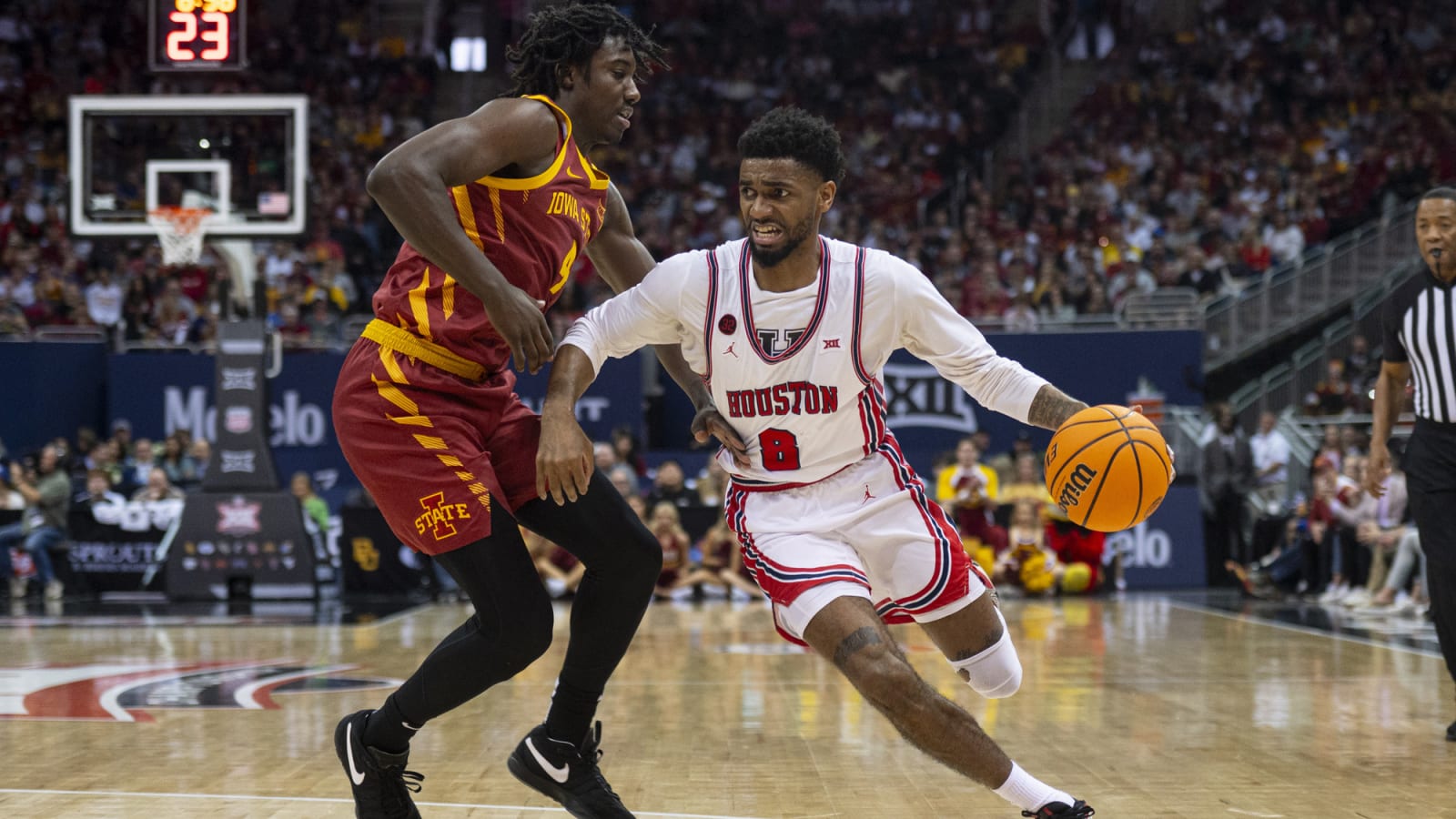 Houston Cougars guard Mylik Wilson (8) handles the ball while defended by Iowa State Cyclones guard Demarion Watson (4)
