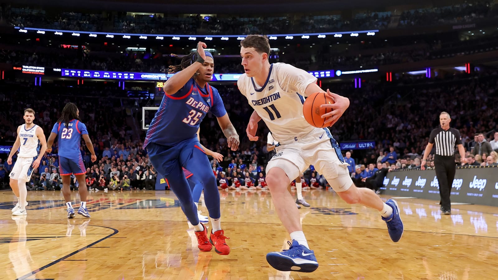 Ryan Kalkbrenner dribbling past DePaul Blue Demons forward NJ Benson