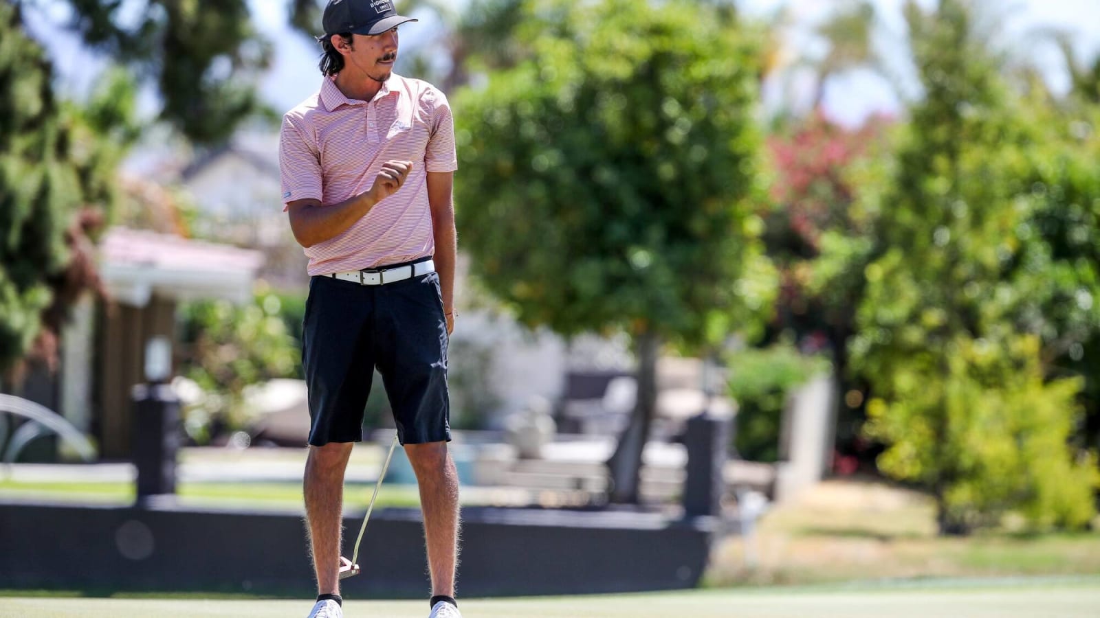 Amateur golfer Mark Williams watches putt miss on 9th green