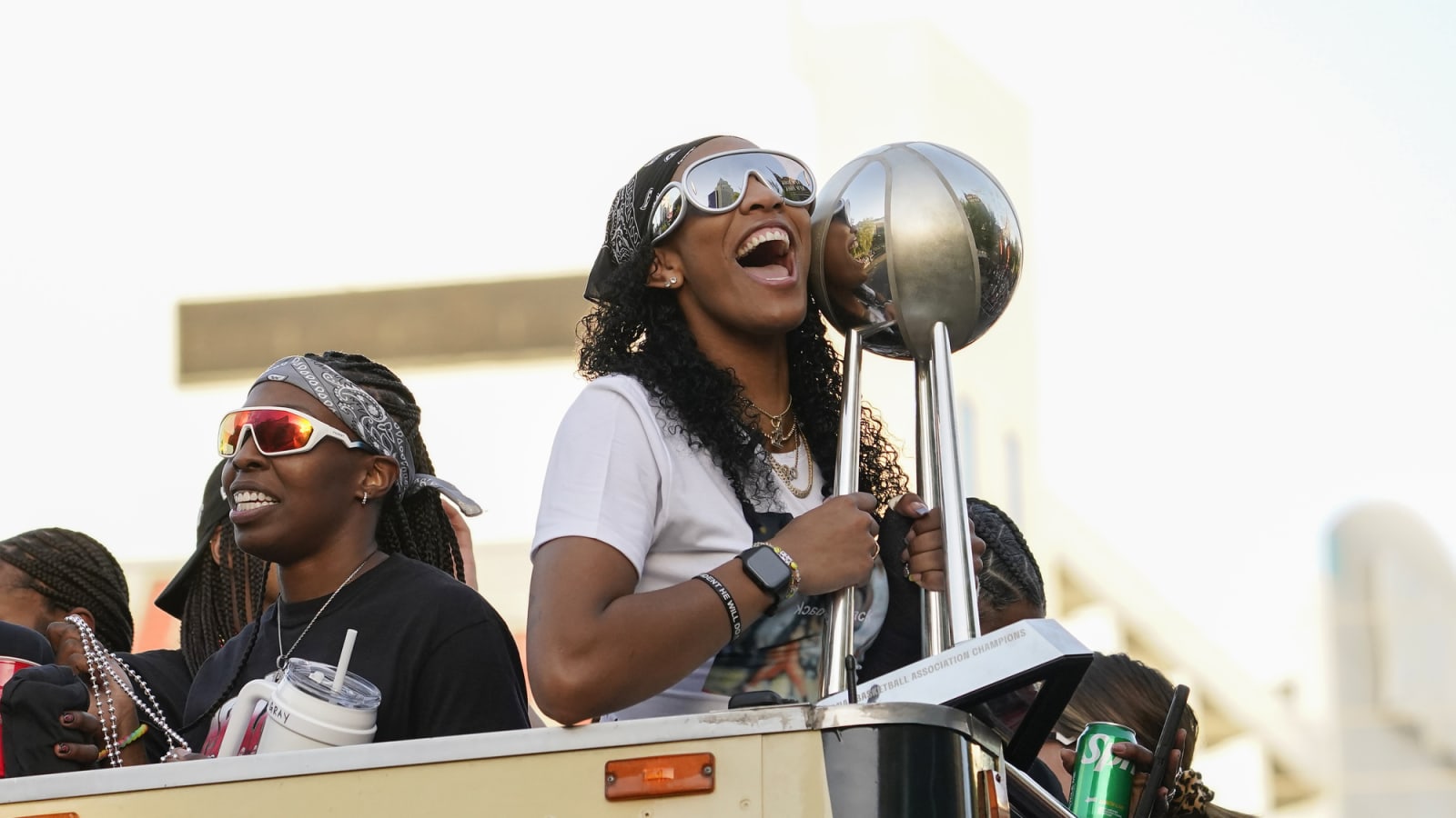 Aces forward A'ja Wilson holds WNBA Championship trophy during parade on Las Vegas Strip