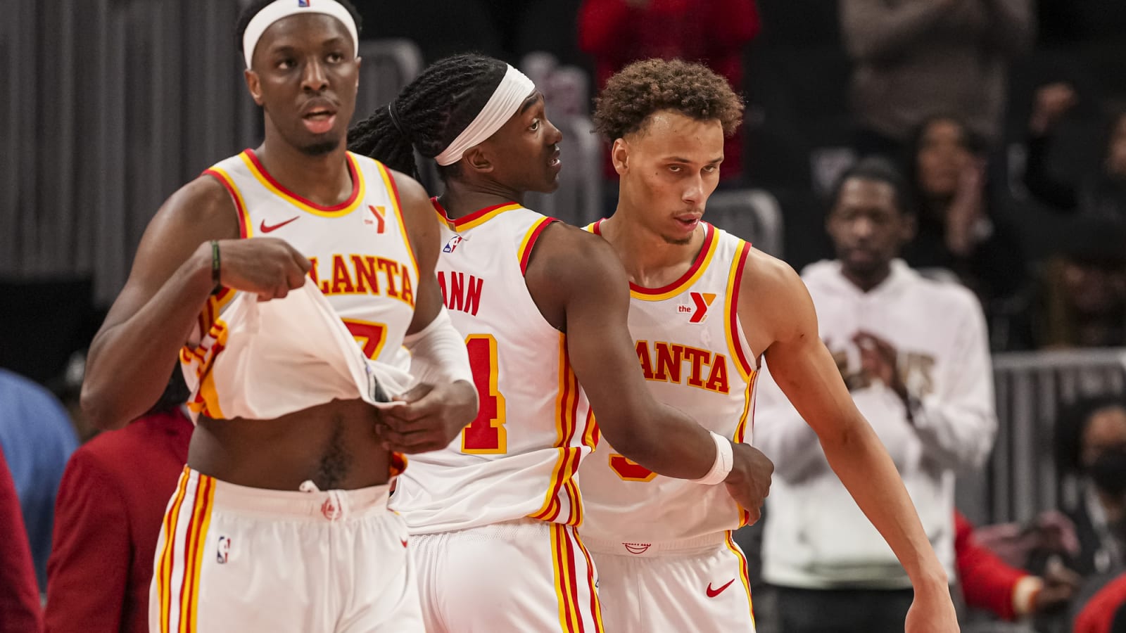 Onyeka Okongwu, Terance Mann, and Dyson Daniels react after Hawks win
