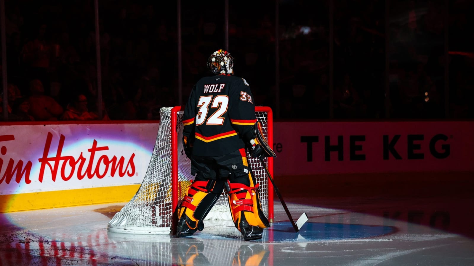 Why was Flames netminder Dustin Wolf pulled after the second period in Toronto?