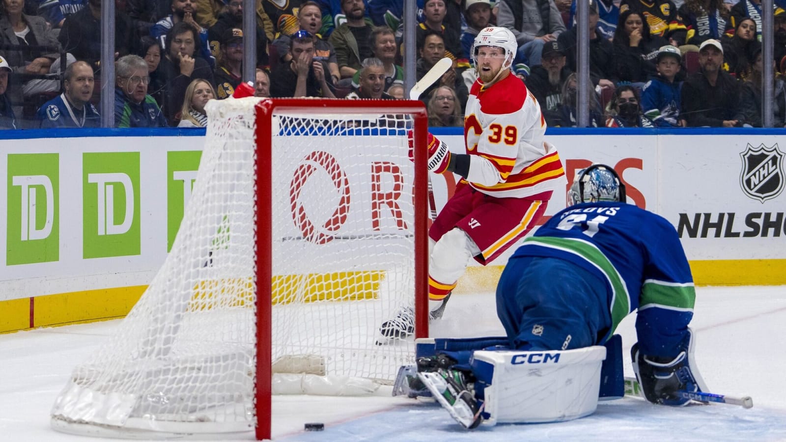Chaos reigns in wild Flames opening period against Canucks