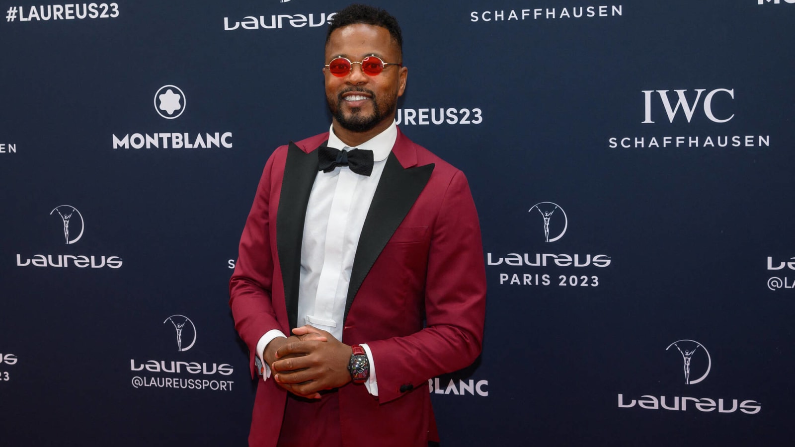 Watch: Former Man United star Patrice Evra turns up at Man City in a red suit