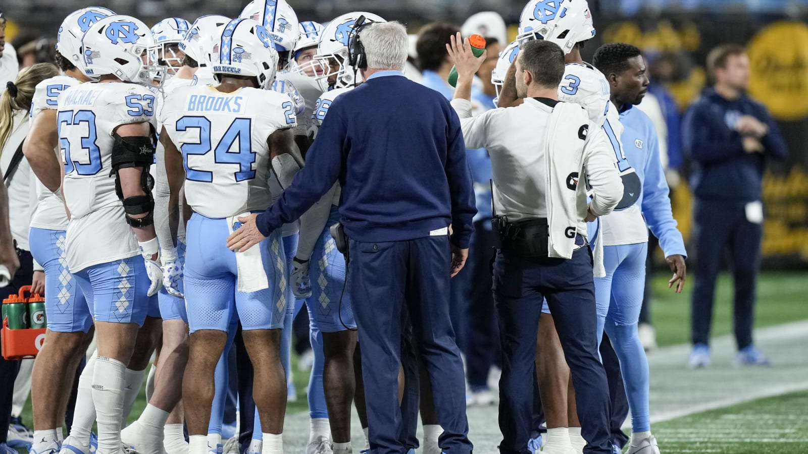 Mack Brown encourages team in huddle against West Virginia