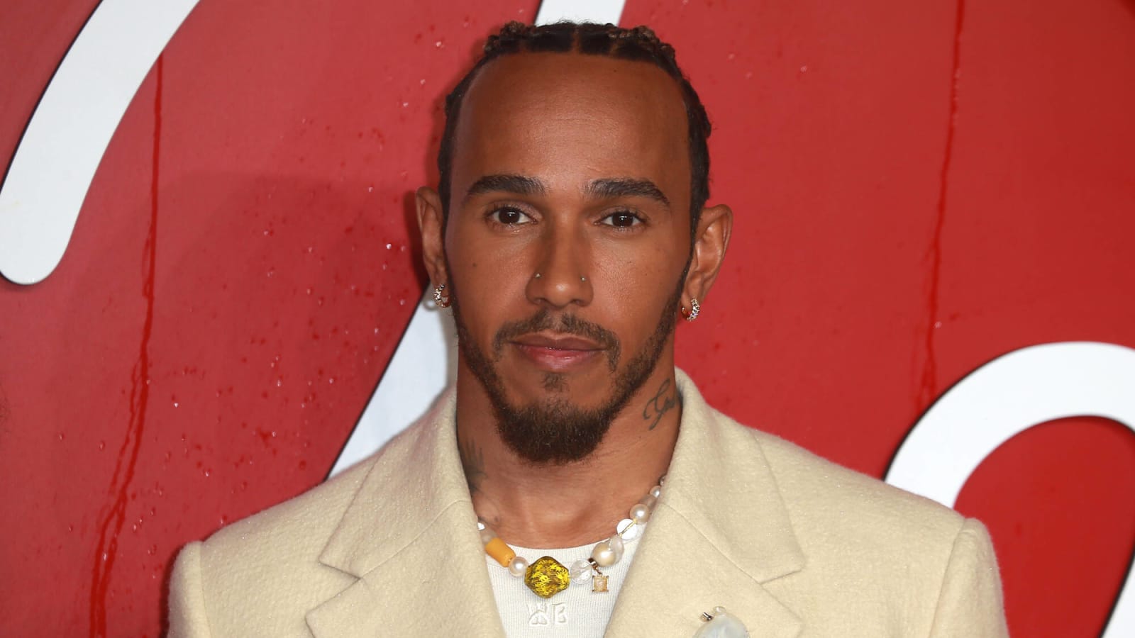 What companies does Lewis Hamilton own?