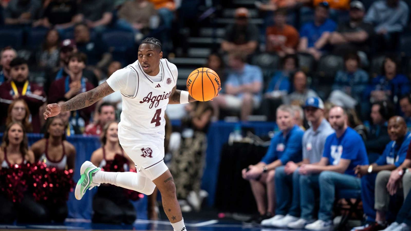 Wade Taylor IV (4) brings the ball up court against Texas in the SEC Men's Basketball Tournament second round