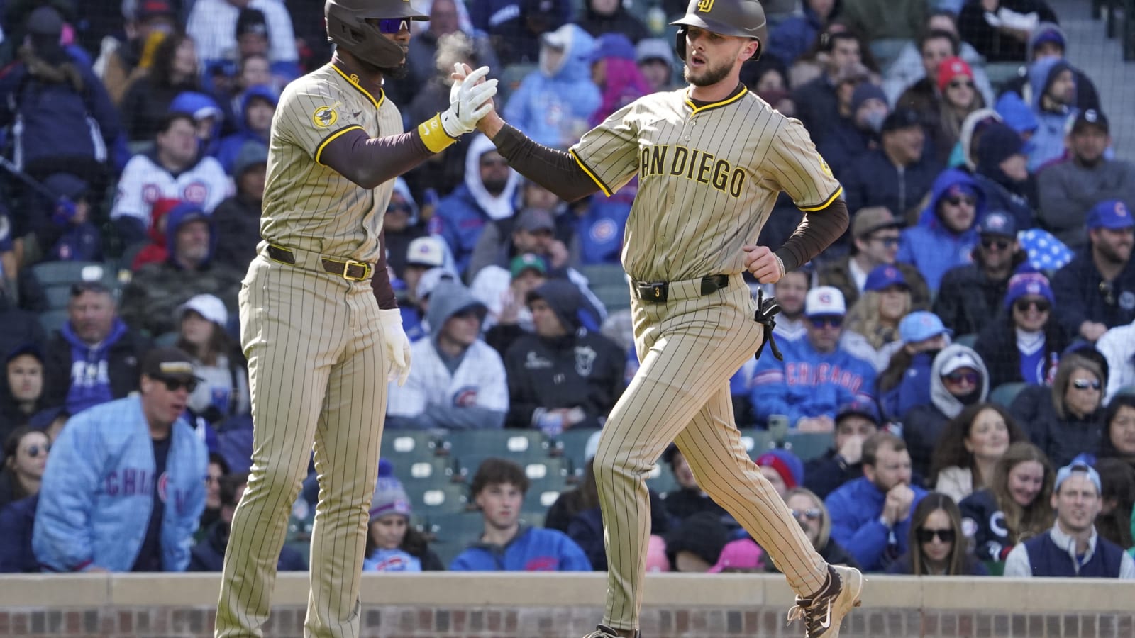 Jackson Merrill scores, greeted by Jason Heyward at Wrigley Field