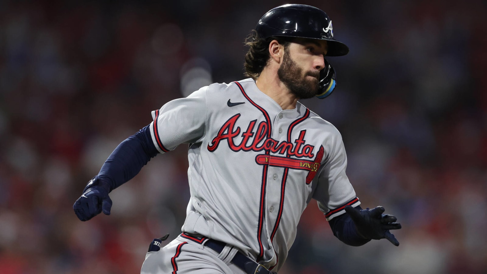 Dansby Swanson #7 of the Atlanta Braves looks on from third base during a  pitching change in the sixth inning during MLB g…