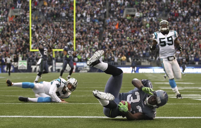 Punter trips up Leon Washington