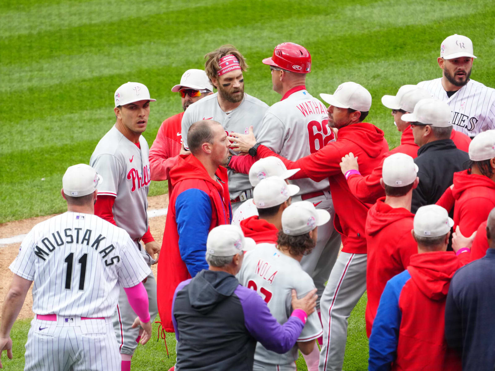 Phillies' Bryce Harper ejected after charging Rockies dugout