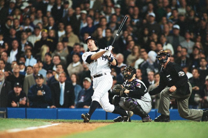 Scott Brosius of the New York Yankees celebrates hitting a home