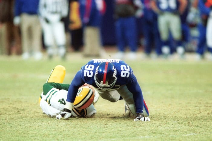 Helps Michael Strahan set the single-season sack record in 2001